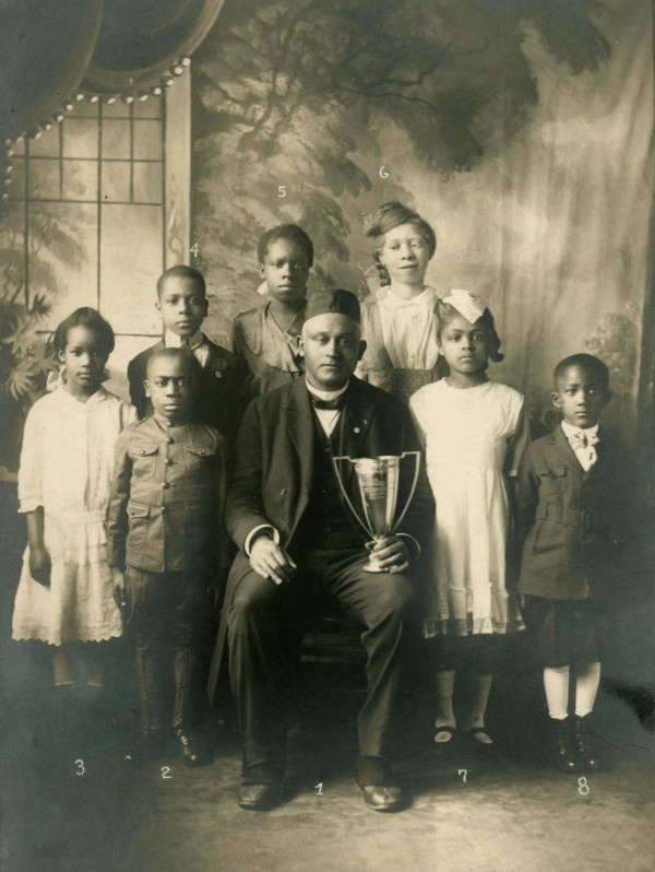 Joseph Cotter and students pose with the &quot;Cotter Cup&quot;