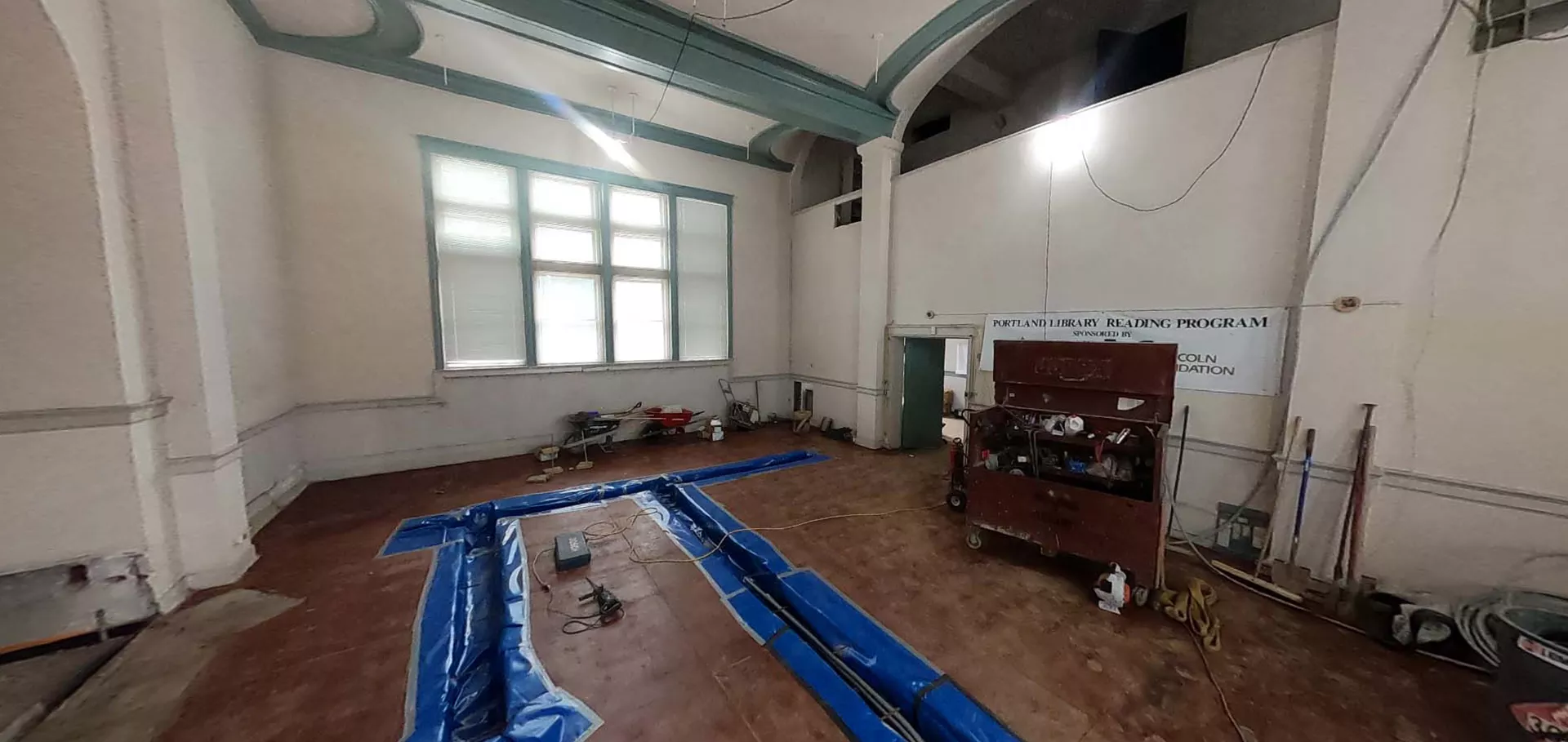 Work being don on flooring inside the Portland Library
