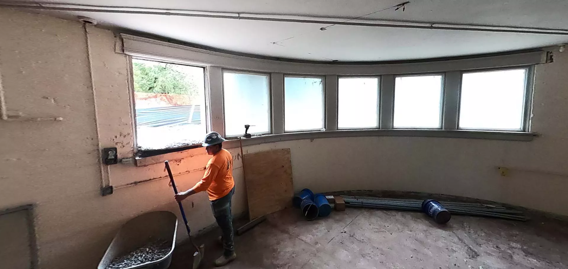 Construction worker by the windows in the Portland Library